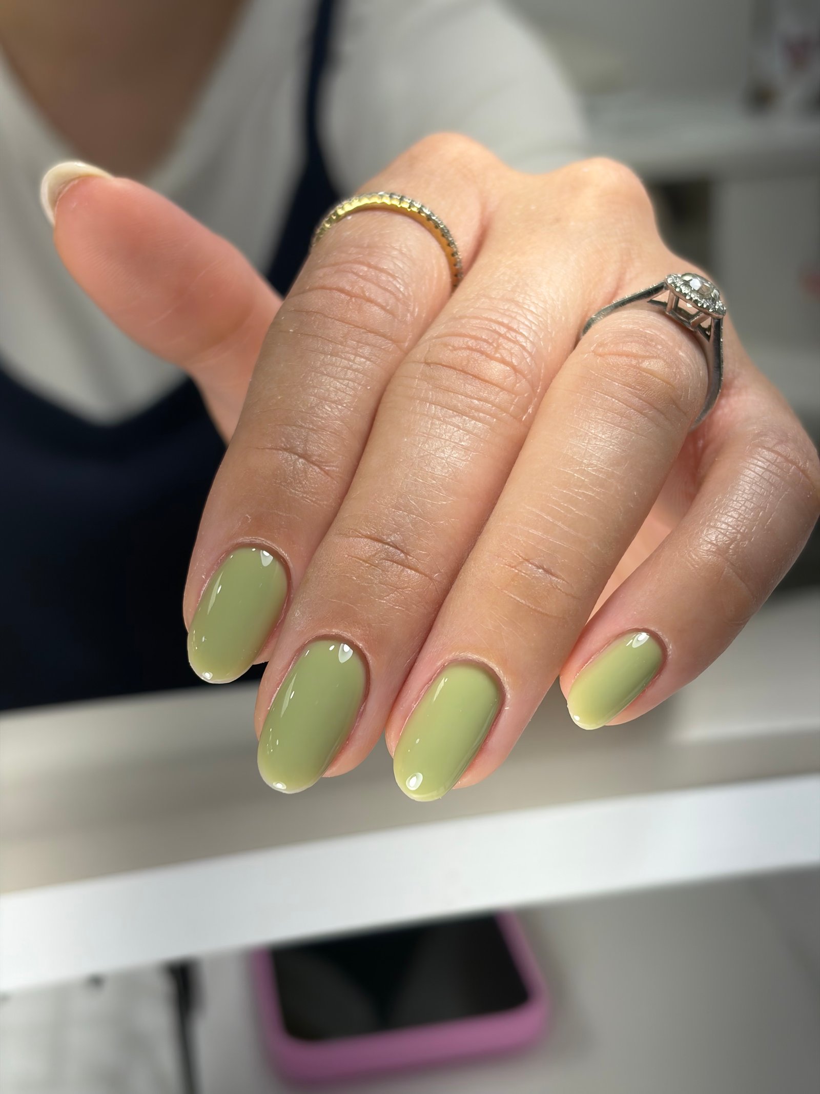 Glossy semi-translucent sage green builder gel Tampa manicure on softly rounded nails