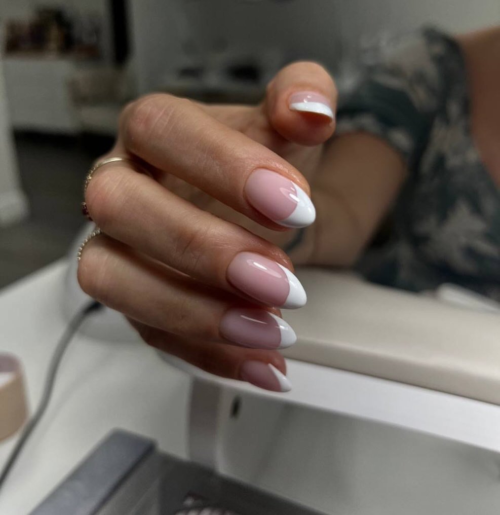 Soft white French russian nails with a translucent pink base in South Tampa