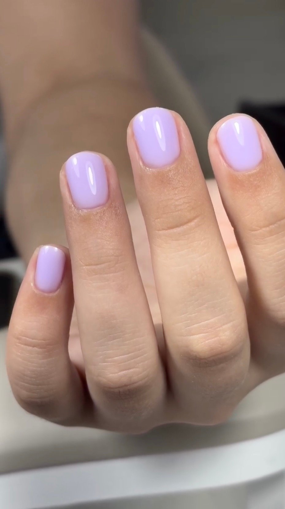 Short glossy lavender hard gel extensions Tampa manicure with softly squared nails