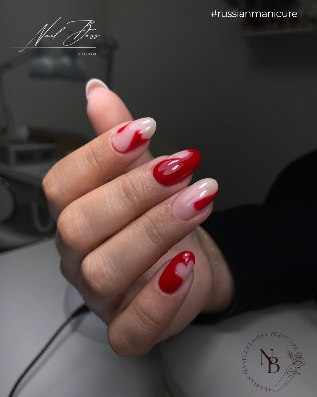 Glossy almond Russian manicure Tampa nails with red cherry details on a sheer pink base