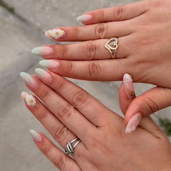 Green ombré almond nails with dimensional white floral nail art