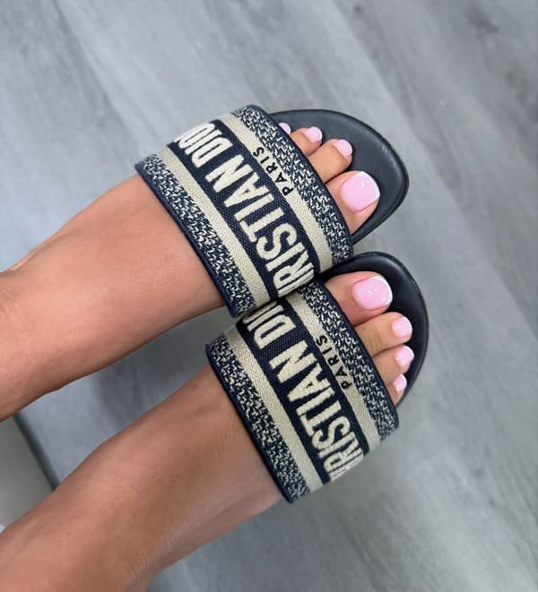 Soft pink dry pedicure shown in open-toe slides